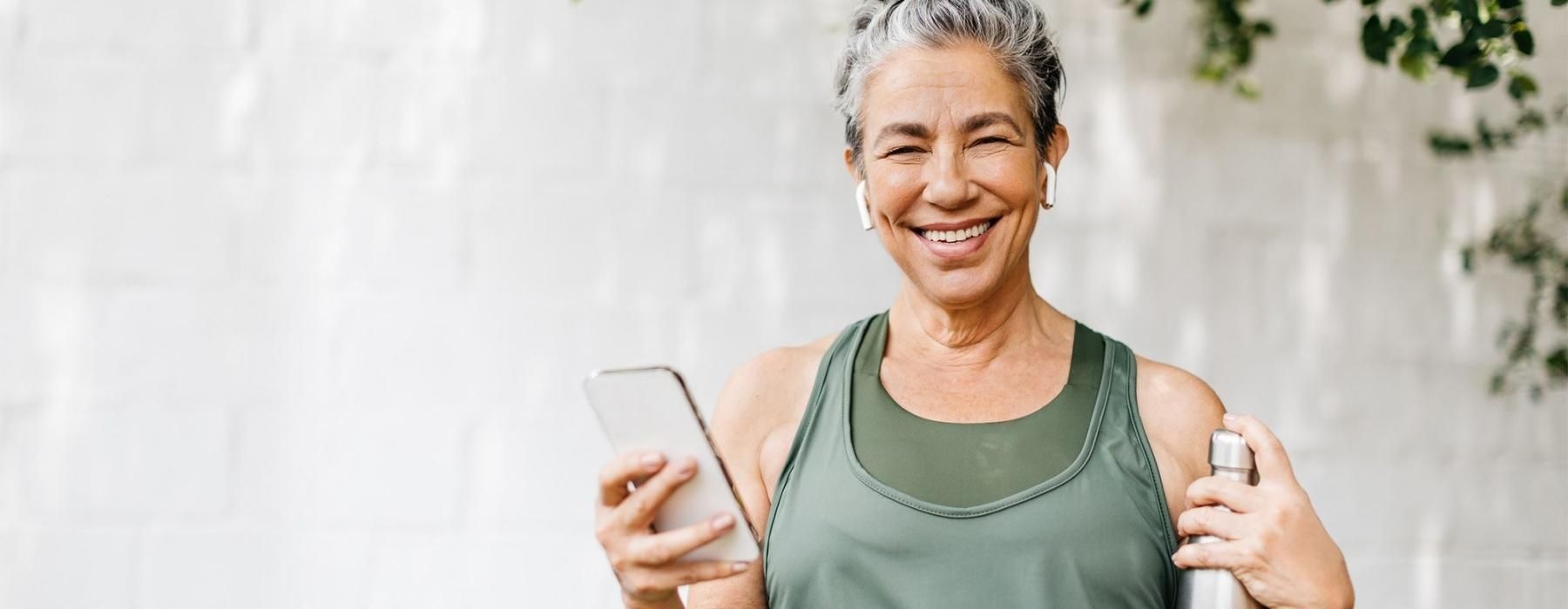 a woman holding a phone